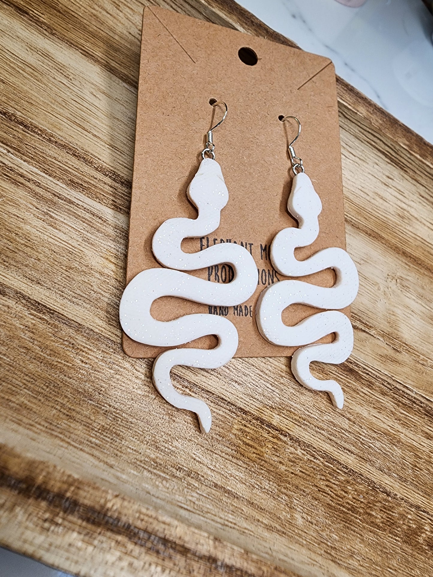 White Shimmery Snake Earrings