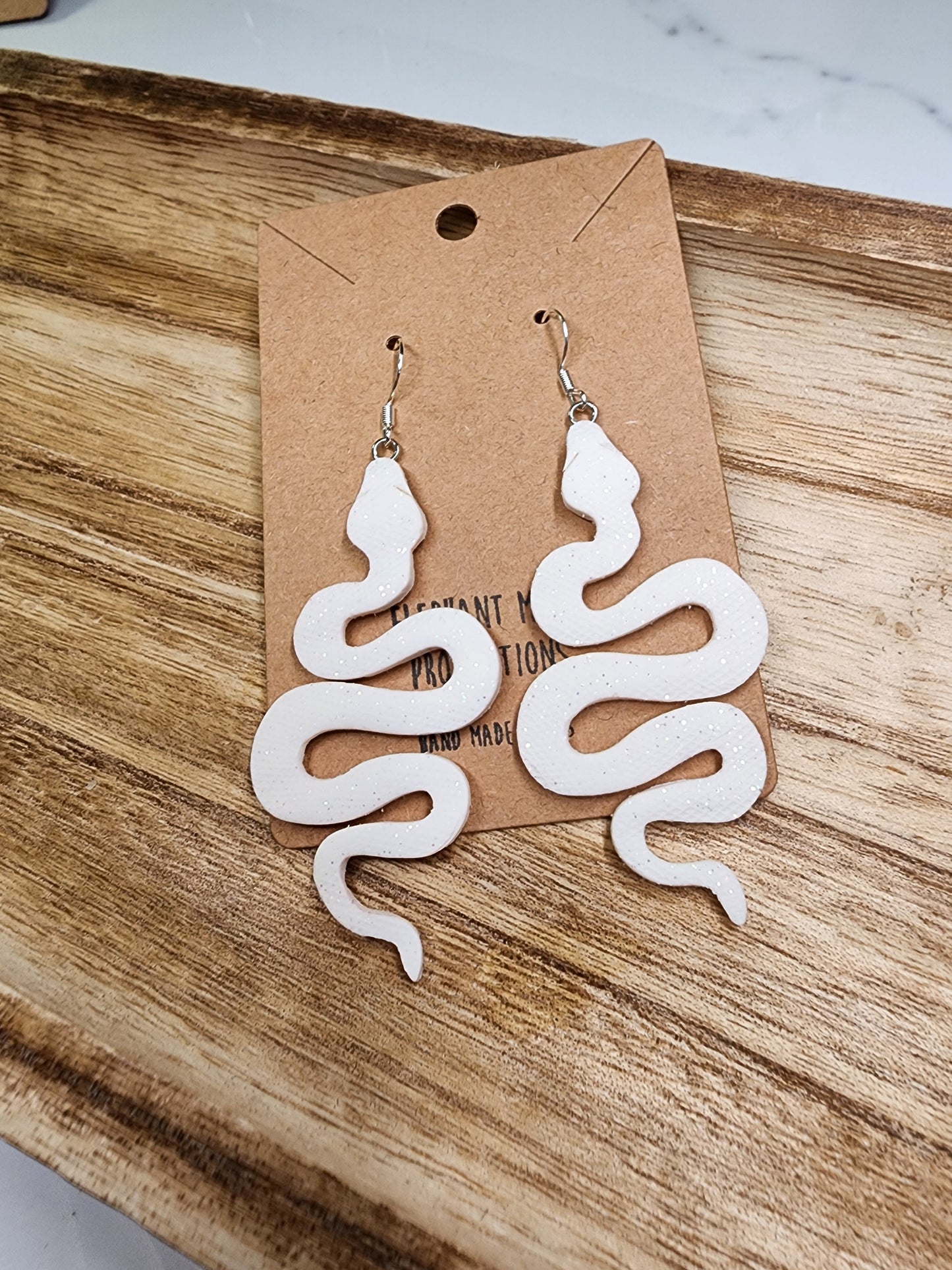 White Shimmery Snake Earrings